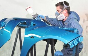 Painting blue car bumper by proffesional.